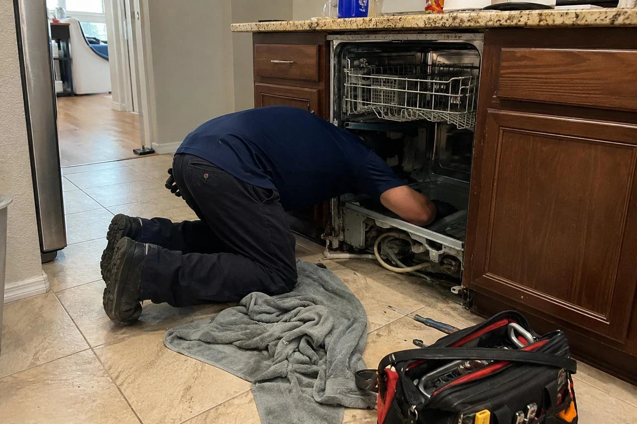 Dishwasher Repair technician diagnosing a dishwasher problem