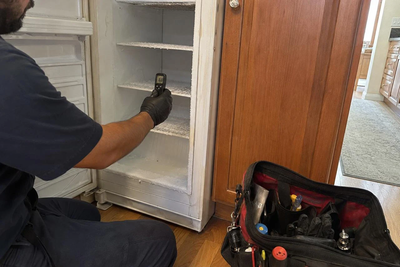 Freezer Repair technician diagnosing a freezer problem
